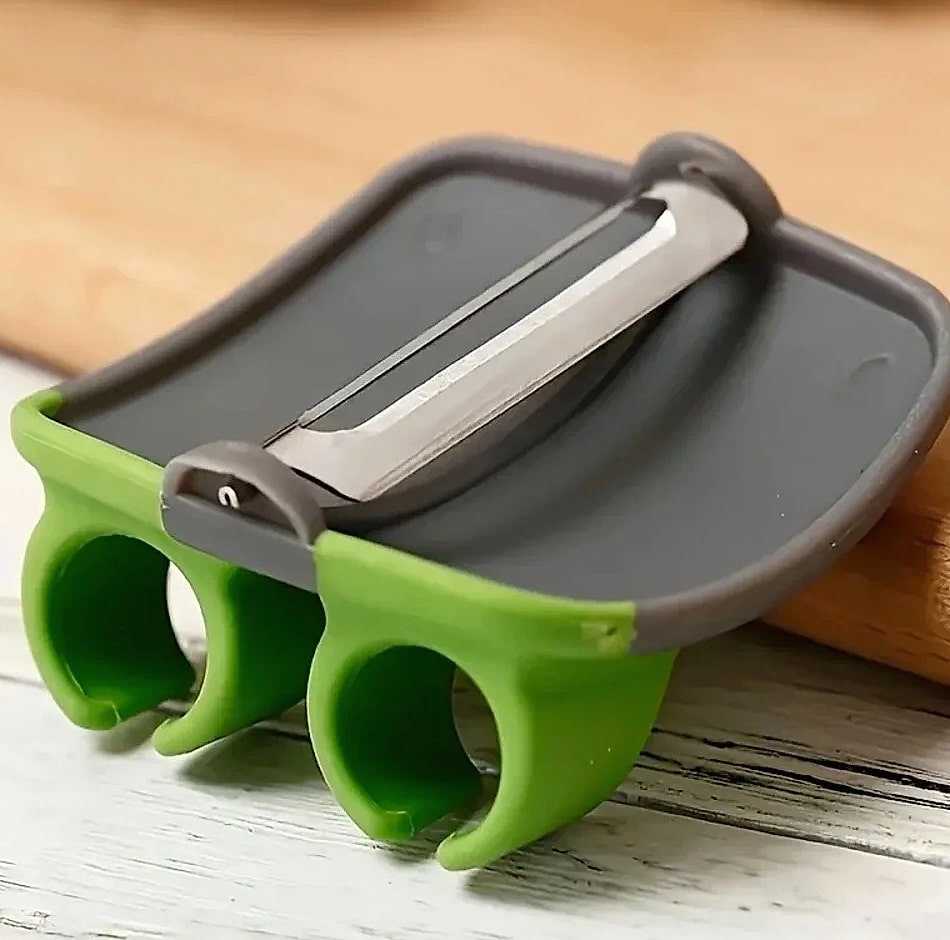 Black and Green Kitchen Peeler with Sharp Blade and Grip